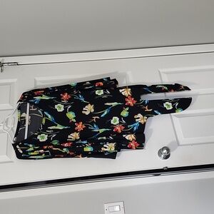 Black with floral print blouse with ties in left bottom corner